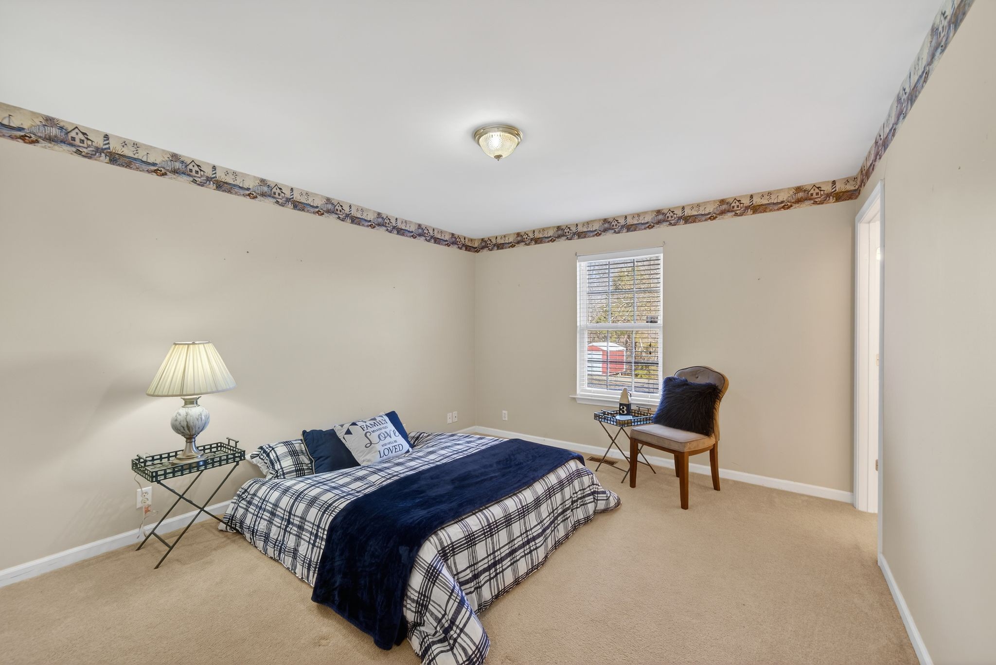 833 Blakemore Road Dickson, TN 37055 - Photo 12 of 47 a bedroom with a bed and a lamp on table