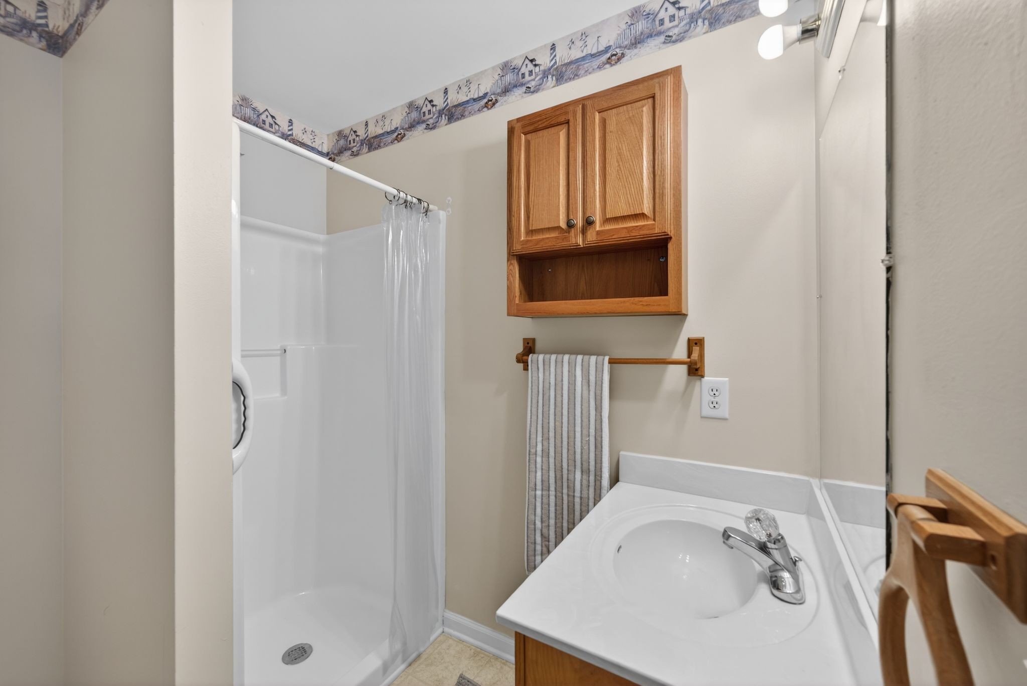 833 Blakemore Road Dickson, TN 37055 - Photo 13 of 47 a bathroom with a sink a window and a mirror