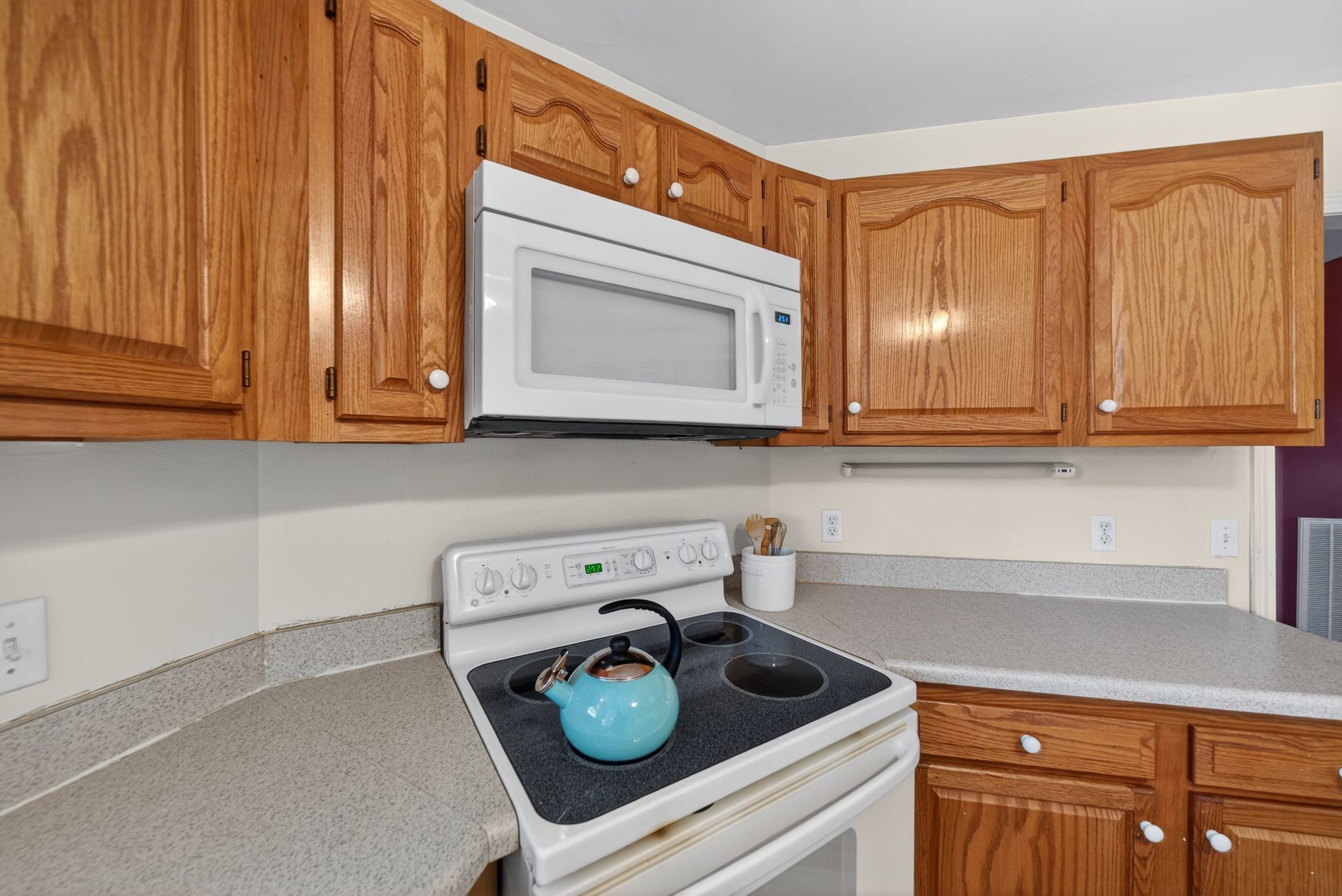 833 Blakemore Road Dickson, TN 37055 - Photo 17 of 47 a kitchen with a stove a microwave and cabinets