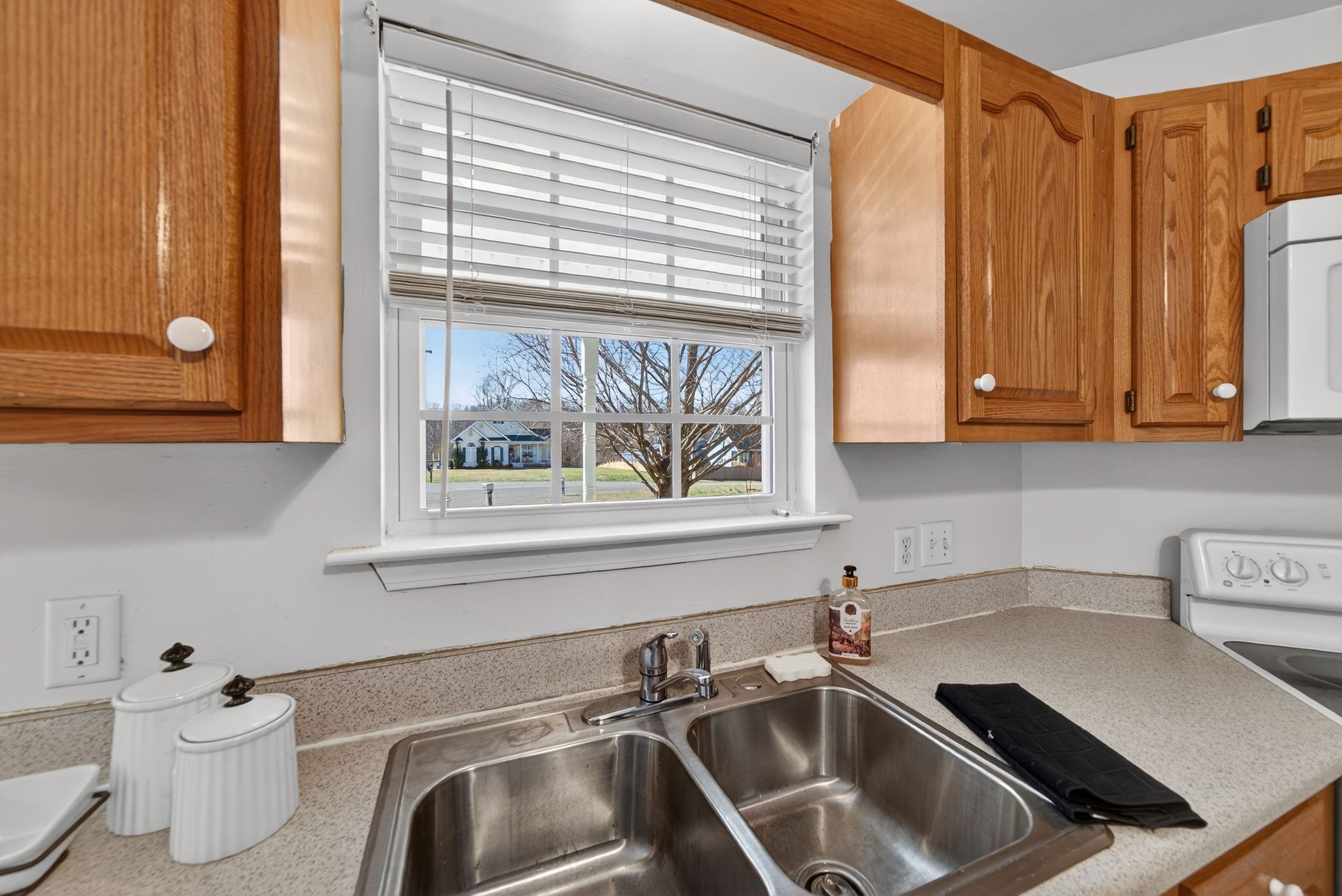 833 Blakemore Road Dickson, TN 37055 - Photo 18 of 47 a kitchen with a sink and a toilet next to a window