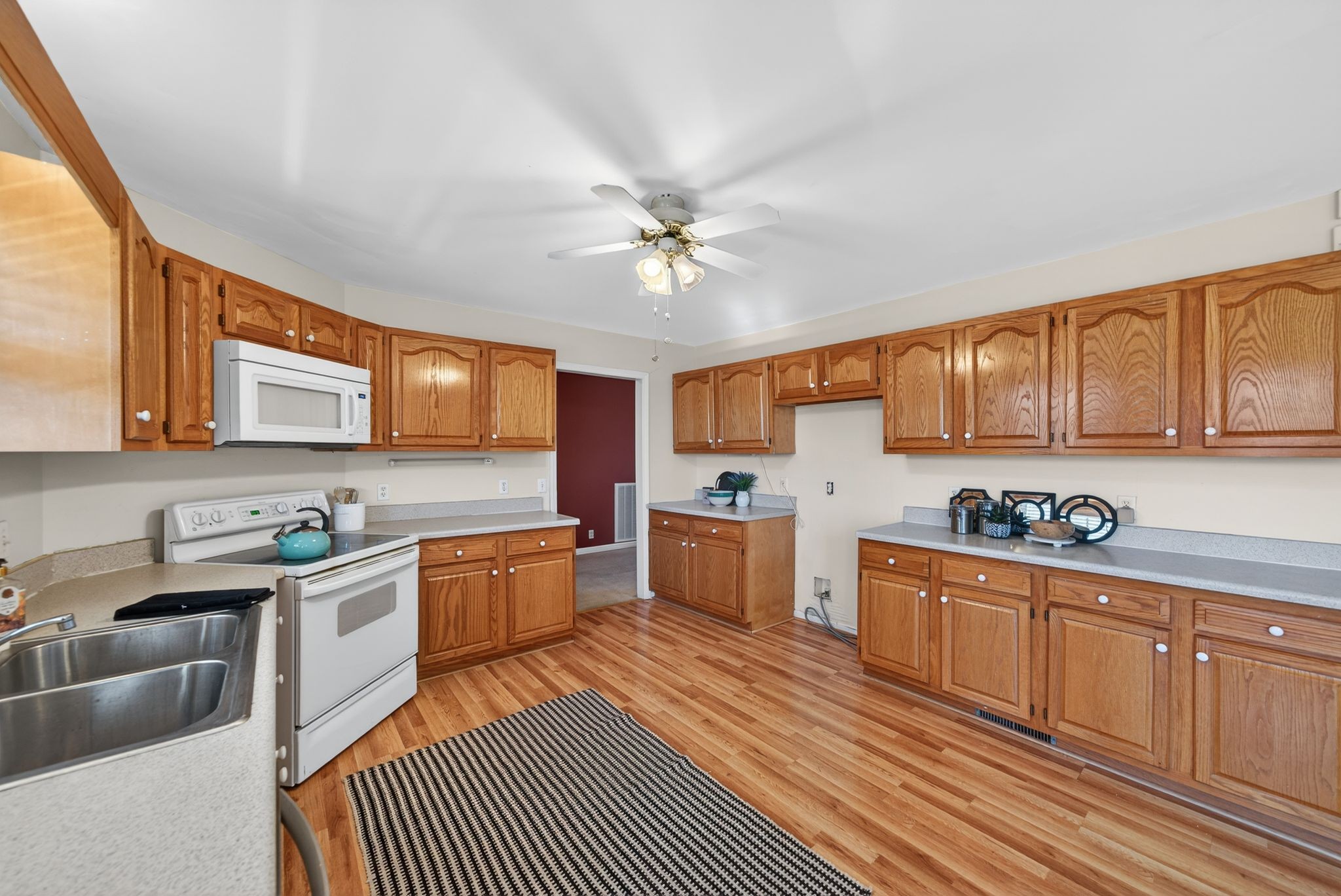 833 Blakemore Road Dickson, TN 37055 - Photo 19 of 47 a kitchen with a sink stove and cabinets