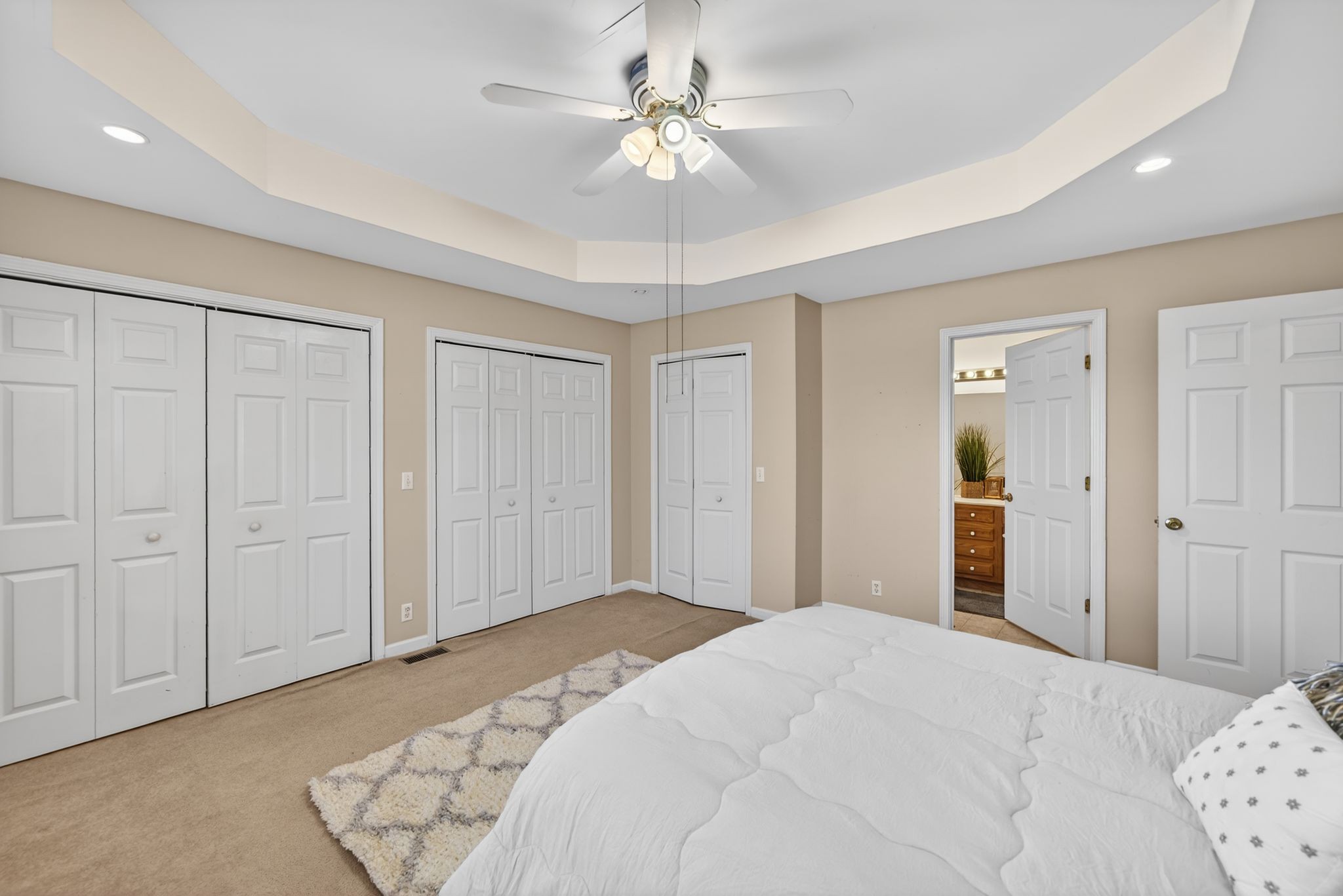 833 Blakemore Road Dickson, TN 37055 - Photo 24 of 47 a bedroom with a bed and a chandelier