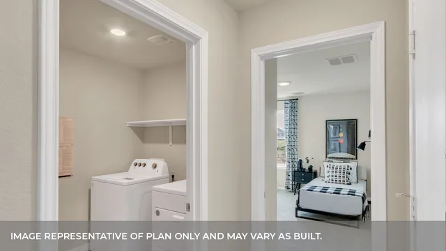 a living room with furniture and mirror