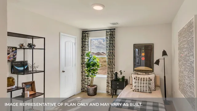 a view of a hallway with wooden floor and a potted plant