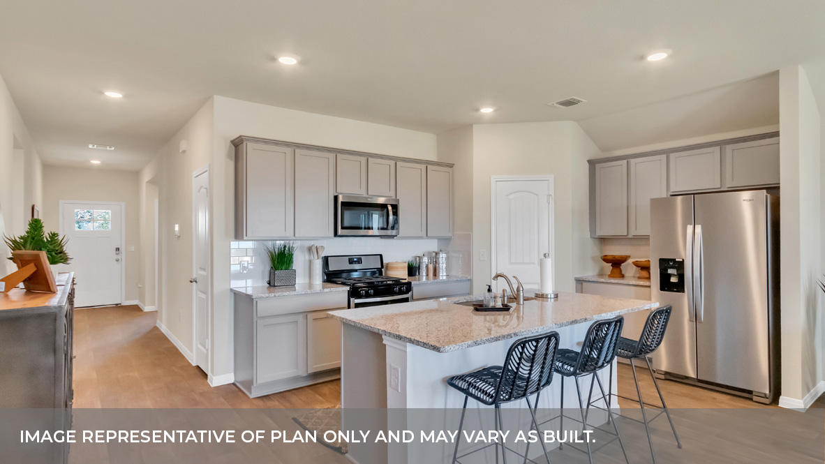 9504 Oxbow Strap Drive Austin, TX 78724 - Photo 16 of 30 a kitchen with refrigerator a sink and chairs