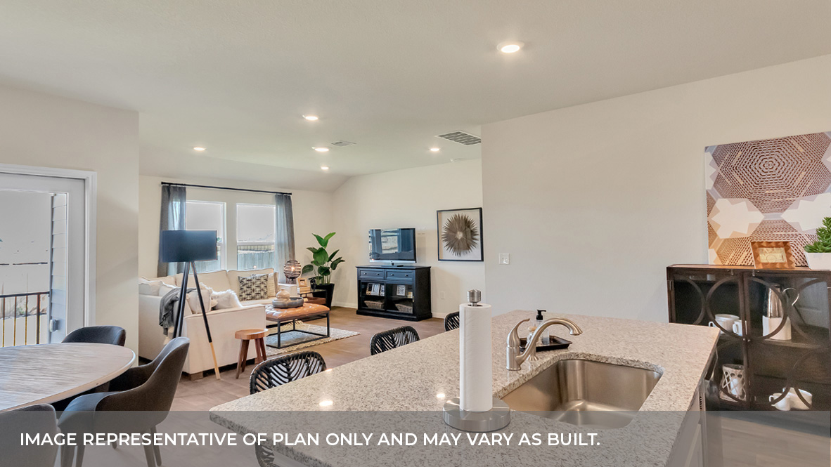 9504 Oxbow Strap Drive Austin, TX 78724 - Photo 18 of 30 a living room with furniture a flat screen tv and a table