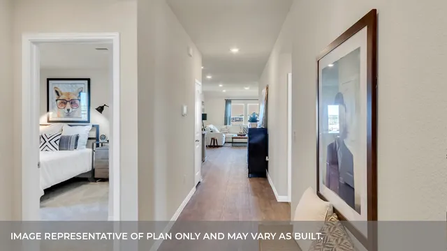 a view of a hallway with a bedroom having bathroom