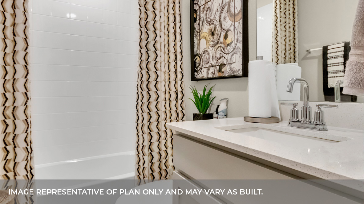 9504 Oxbow Strap Drive Austin, TX 78724 - Photo 6 of 30 a bathroom with a bathtub and a sink