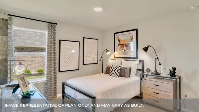 a bedroom with a bed and a dresser with mirror