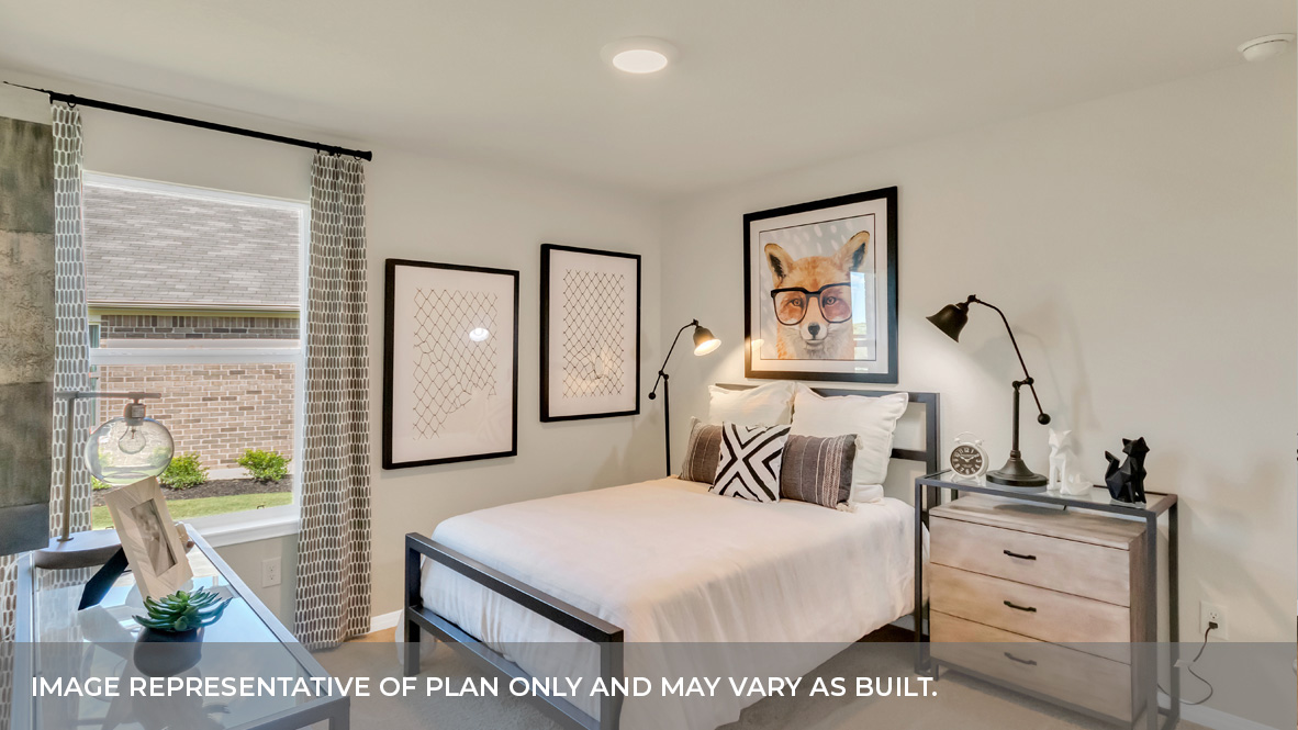 9504 Oxbow Strap Drive Austin, TX 78724 - Photo 7 of 30 a bedroom with a bed and a dresser with mirror