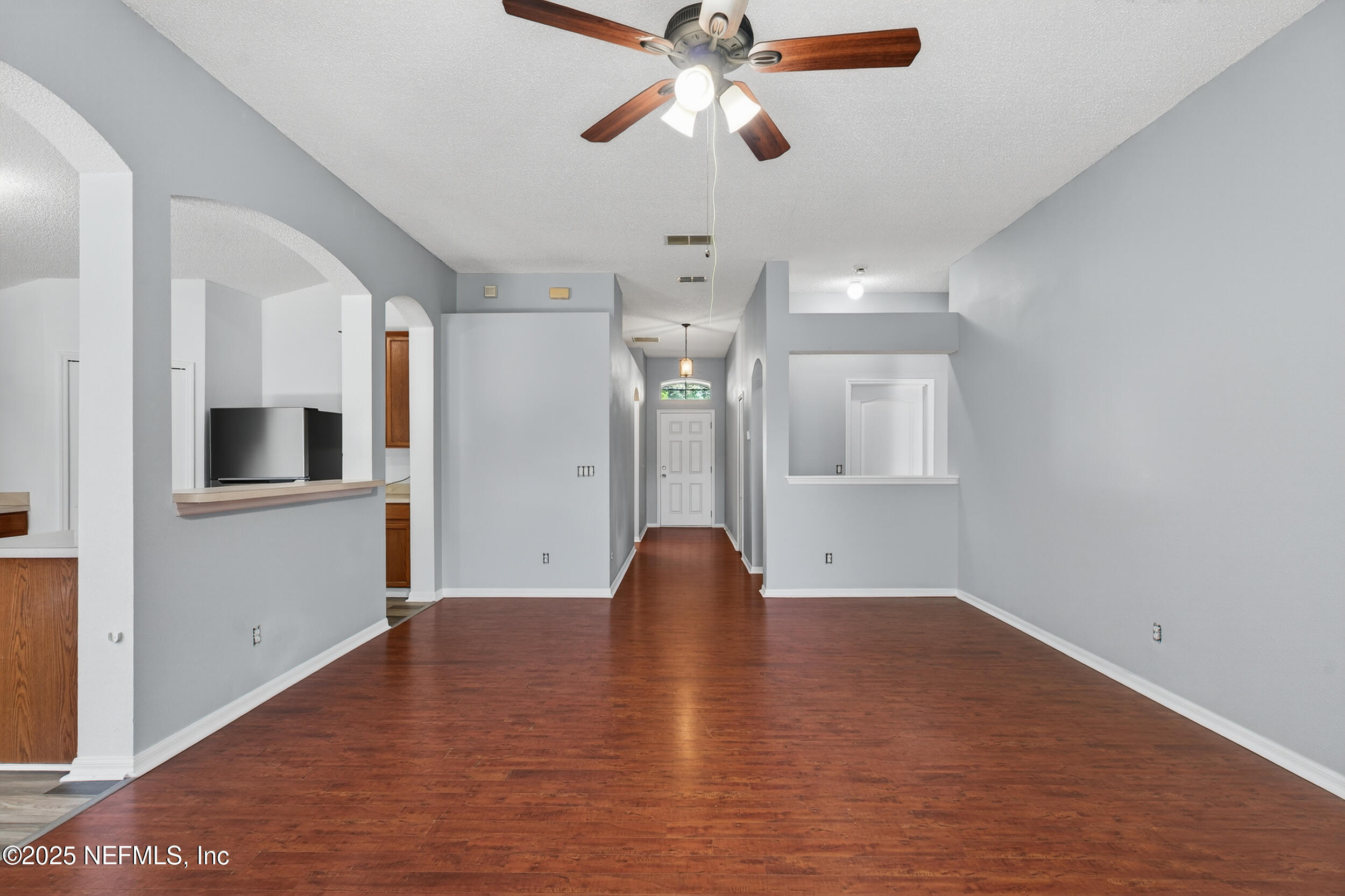 10174 Rising Mist Lane Jacksonville, FL 32221 - Photo 11 of 31 a view of empty room with wooden floor