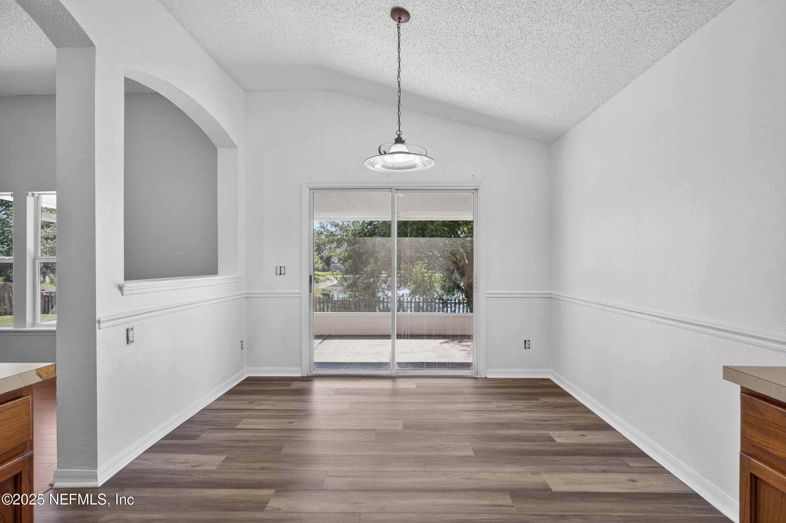 10174 Rising Mist Lane Jacksonville, FL 32221 - Photo 15 of 31 a view of empty room with wooden floor and fan