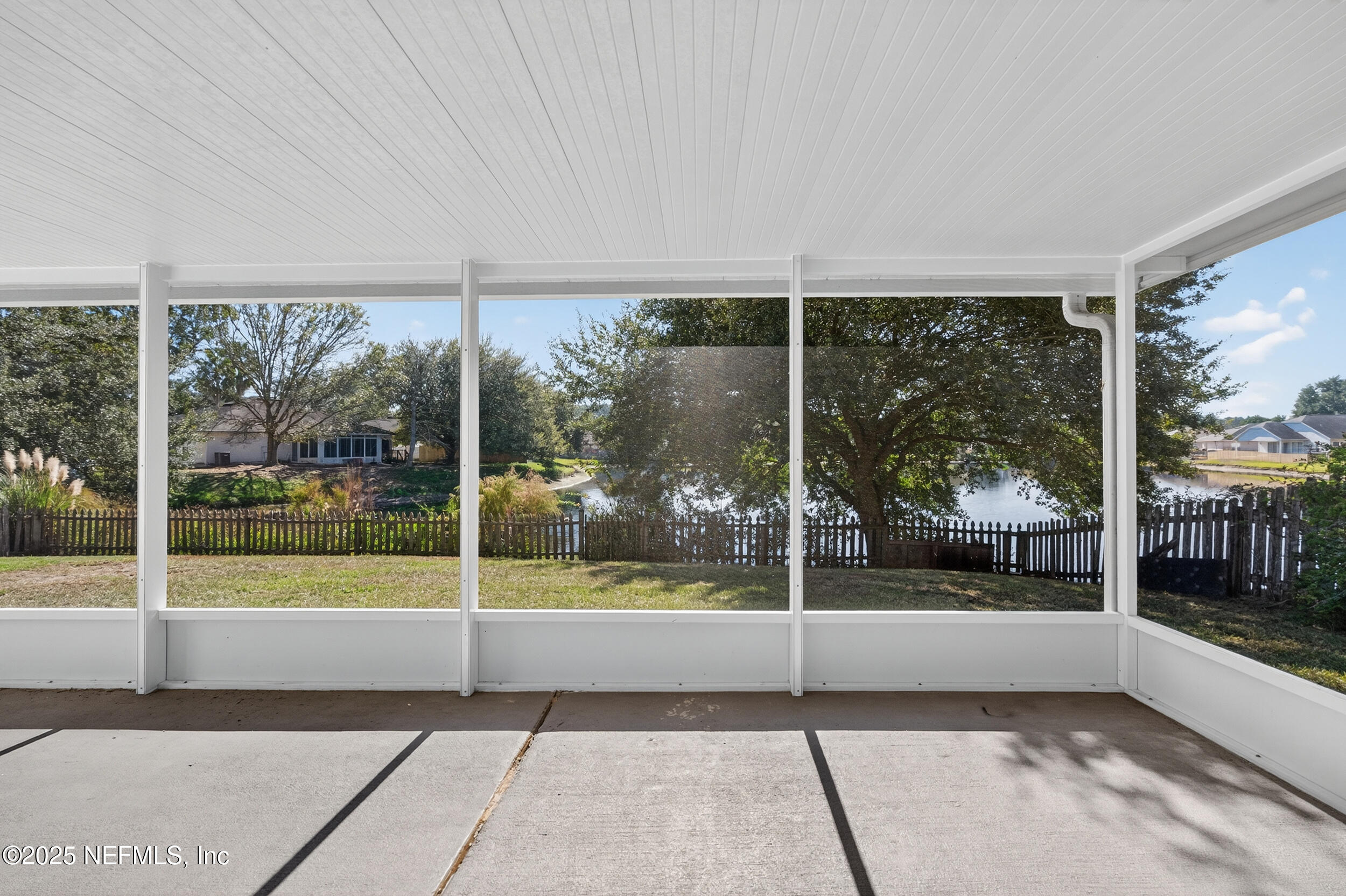 10174 Rising Mist Lane Jacksonville, FL 32221 - Photo 27 of 31 a view of a porch with a floor to ceiling window