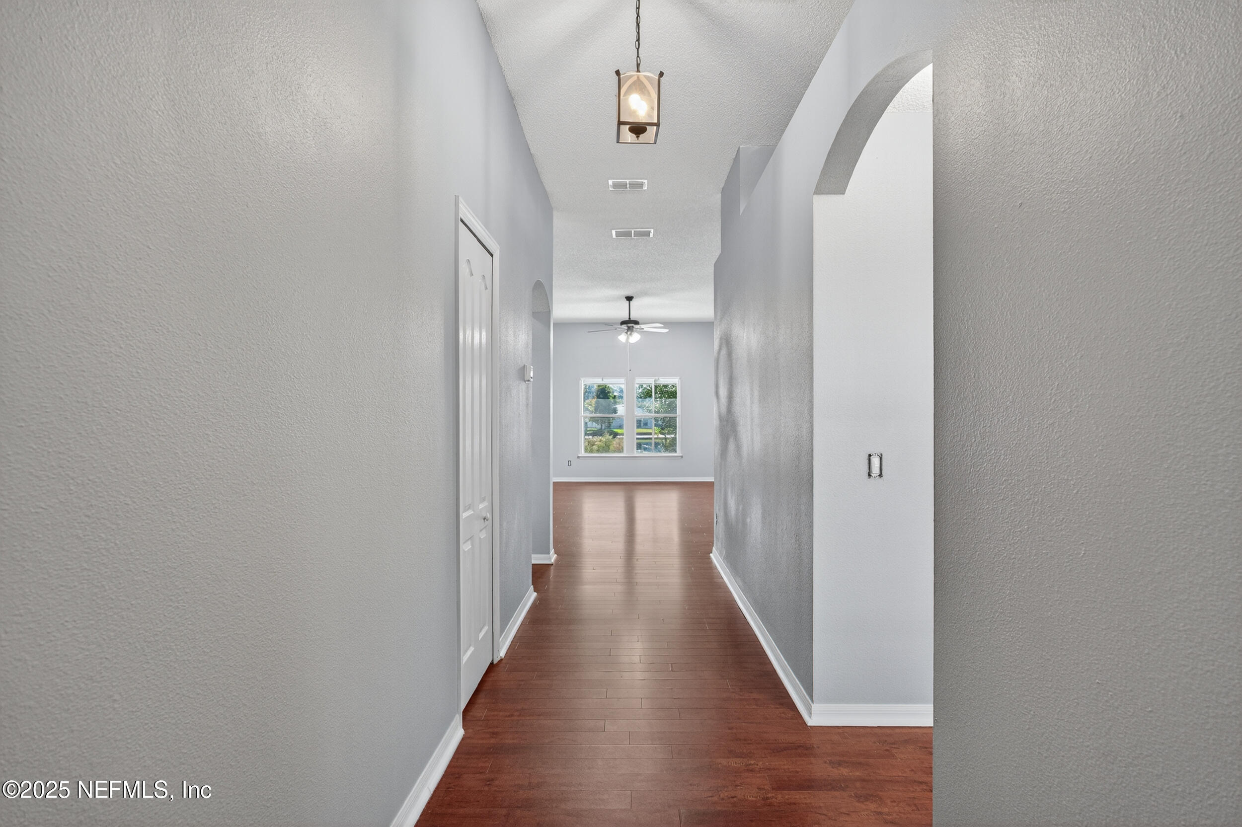 10174 Rising Mist Lane Jacksonville, FL 32221 - Photo 4 of 31 a view of a hallway view with wooden floor