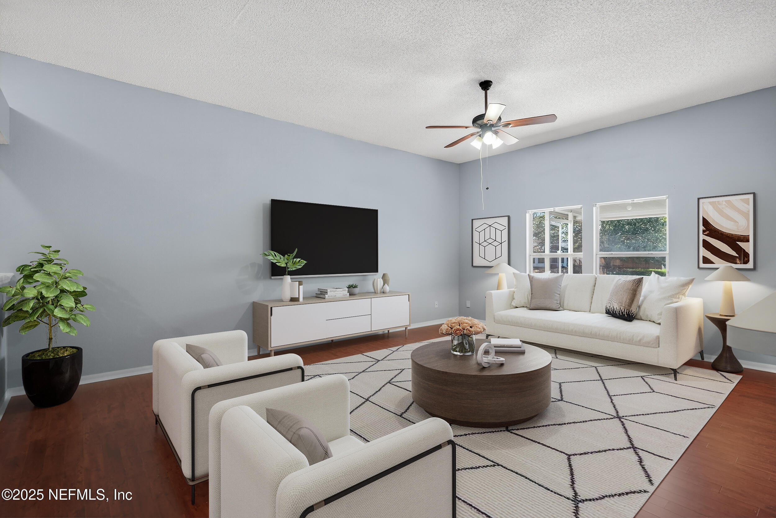 10174 Rising Mist Lane Jacksonville, FL 32221 - Photo 7 of 31 a living room with furniture and a flat screen tv