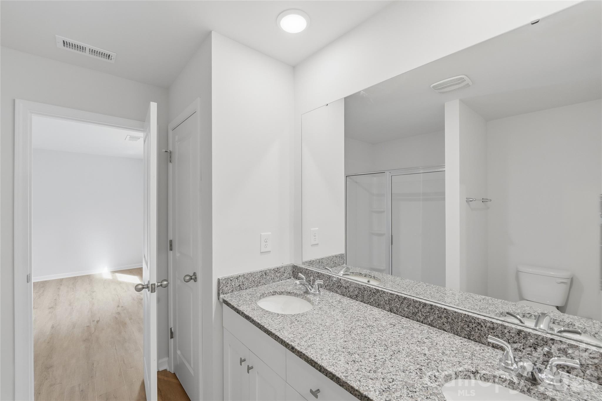 242 Landers Chapel Road Lincolnton, NC 28092 - Photo 29 of 33 a bathroom with a granite countertop sink and a mirror