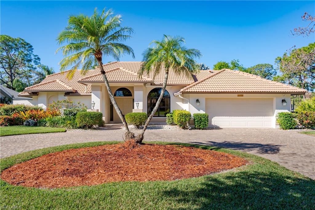 1172 Kings Way Naples, FL 34104 - Photo 12 of 50 a front view of house with yard and entertaining space