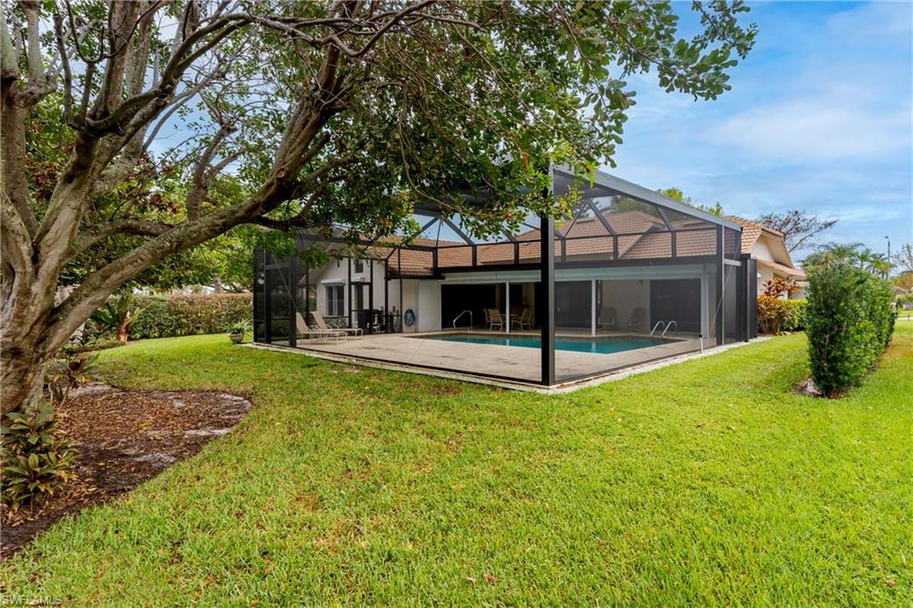 1172 Kings Way Naples, FL 34104 - Photo 13 of 50 a view of house with yard and entertaining space