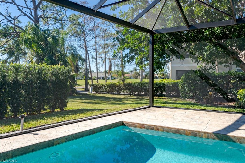 1172 Kings Way Naples, FL 34104 - Photo 16 of 50 a view of swimming pool with an outdoor seating