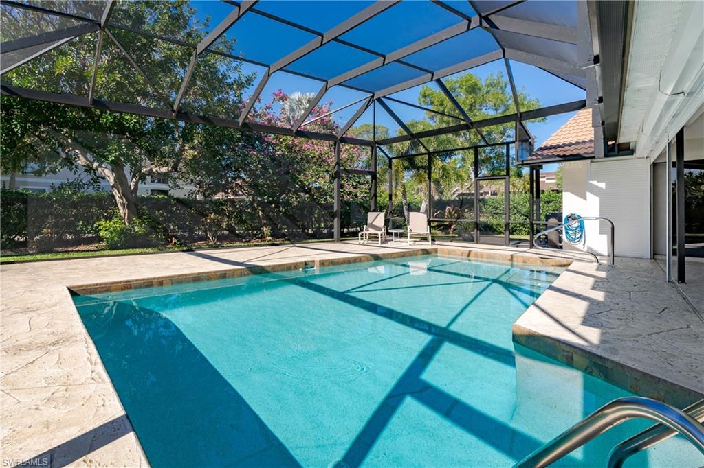 1172 Kings Way Naples, FL 34104 - Photo 17 of 50 a view of a swimming pool with a patio