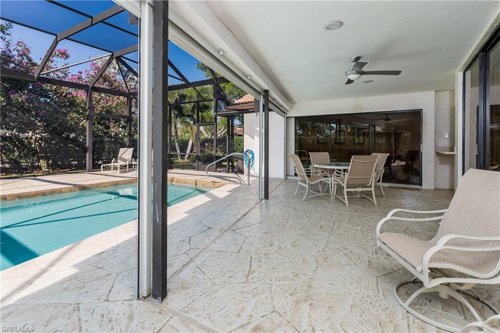 1172 Kings Way Naples, FL 34104 - Photo 18 of 50 a view of a patio with a yard