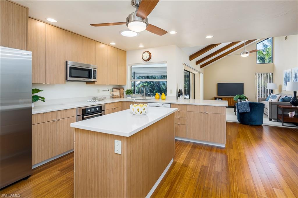 1172 Kings Way Naples, FL 34104 - Photo 20 of 50 a kitchen with a sink appliances and cabinets