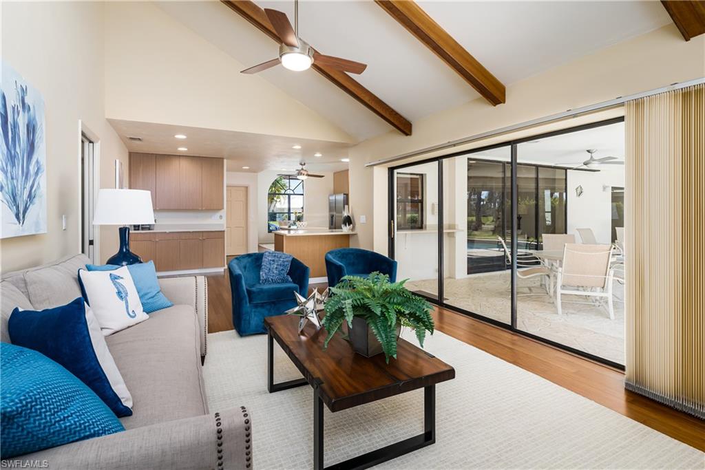 1172 Kings Way Naples, FL 34104 - Photo 2 of 50 a living room with furniture and a glass door