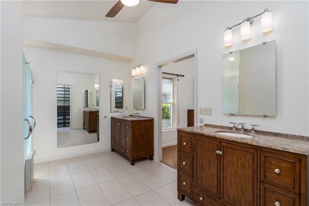 1172 Kings Way Naples, FL 34104 - Photo 25 of 50 a bathroom with a granite countertop sink mirror and double