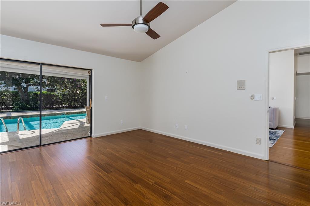 1172 Kings Way Naples, FL 34104 - Photo 27 of 50 a view of empty room with wooden floor and fan