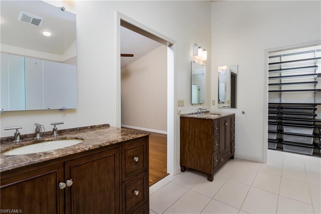 1172 Kings Way Naples, FL 34104 - Photo 29 of 50 a bathroom with a granite countertop sink and a mirror