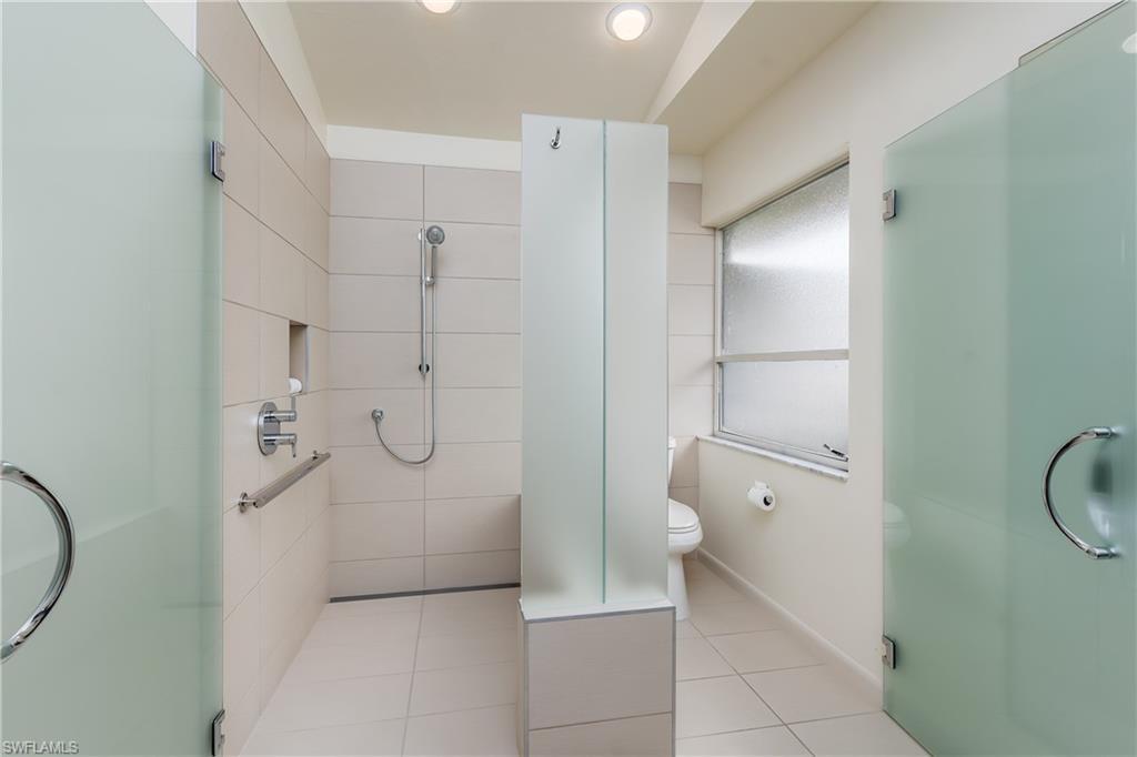 1172 Kings Way Naples, FL 34104 - Photo 30 of 50 a bathroom with a granite countertop shower and a sink