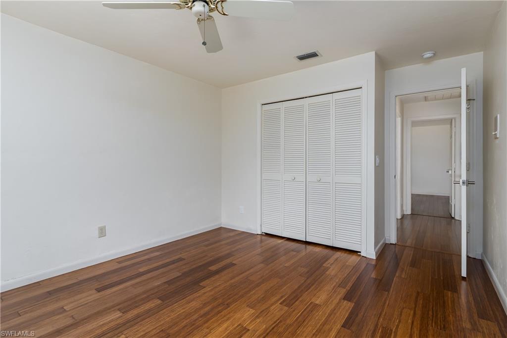 1172 Kings Way Naples, FL 34104 - Photo 34 of 50 wooden floor in an empty room