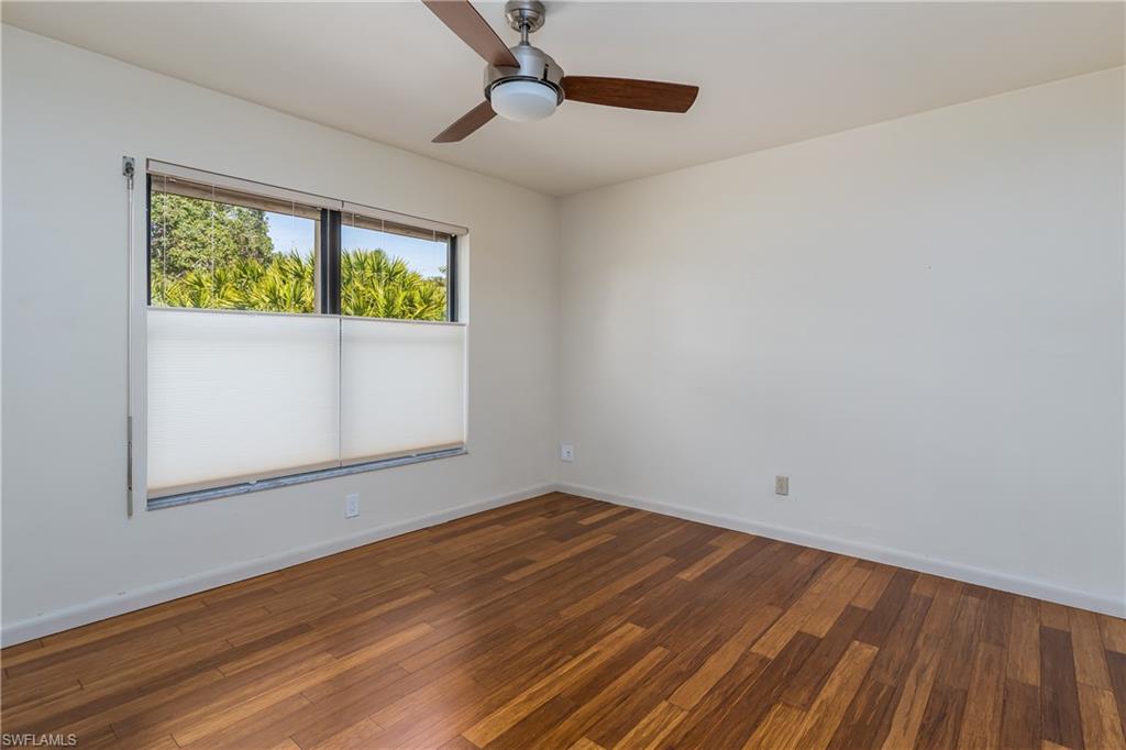 1172 Kings Way Naples, FL 34104 - Photo 37 of 50 a view of empty room with wooden floor and fan