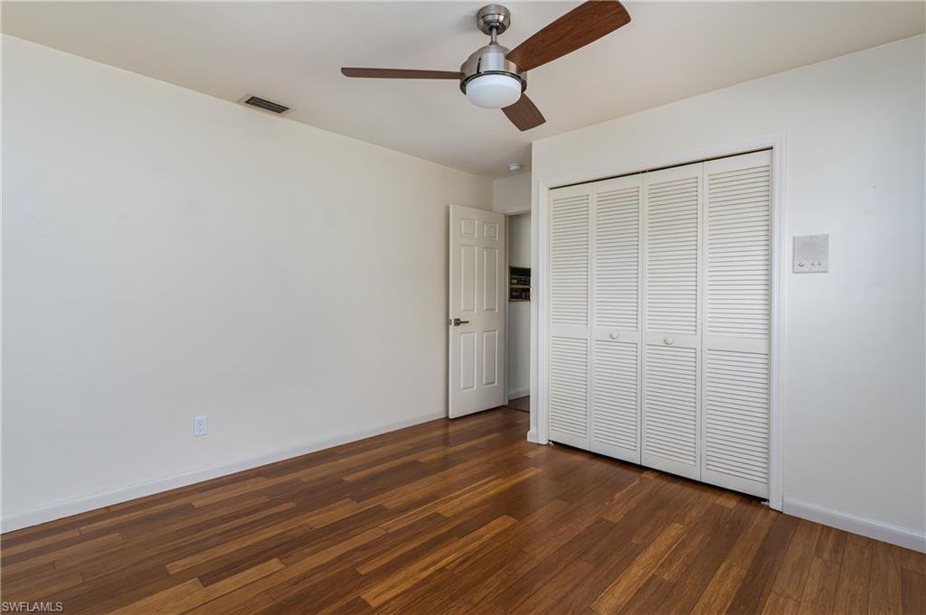 1172 Kings Way Naples, FL 34104 - Photo 38 of 50 a view of empty room with wooden floor