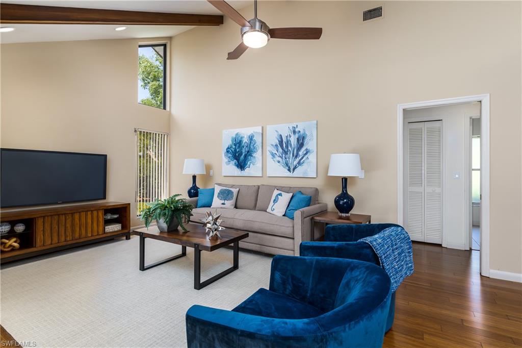 1172 Kings Way Naples, FL 34104 - Photo 4 of 50 a living room with furniture and a flat screen tv