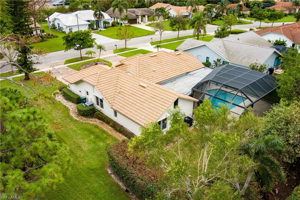 1172 Kings Way Naples, FL 34104 - Photo 43 of 50 an aerial view of a house with swimming pool and outdoor seating