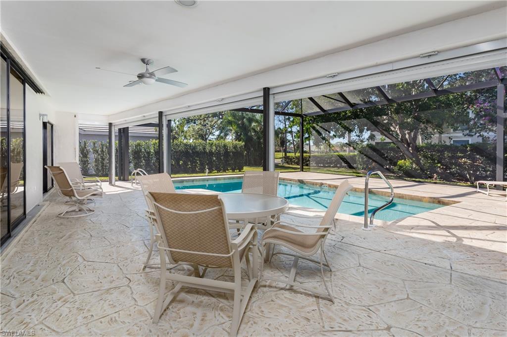 1172 Kings Way Naples, FL 34104 - Photo 50 of 50 a building outdoor space with patio furniture and potted plants
