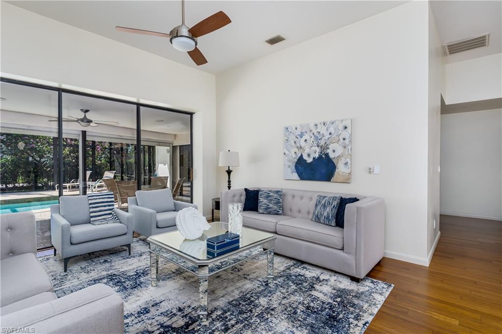 1172 Kings Way Naples, FL 34104 - Photo 7 of 50 a living room with furniture and a large window