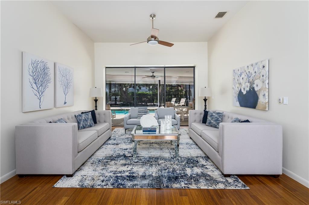 1172 Kings Way Naples, FL 34104 - Photo 8 of 50 a living room with furniture or couch and a wooden floor
