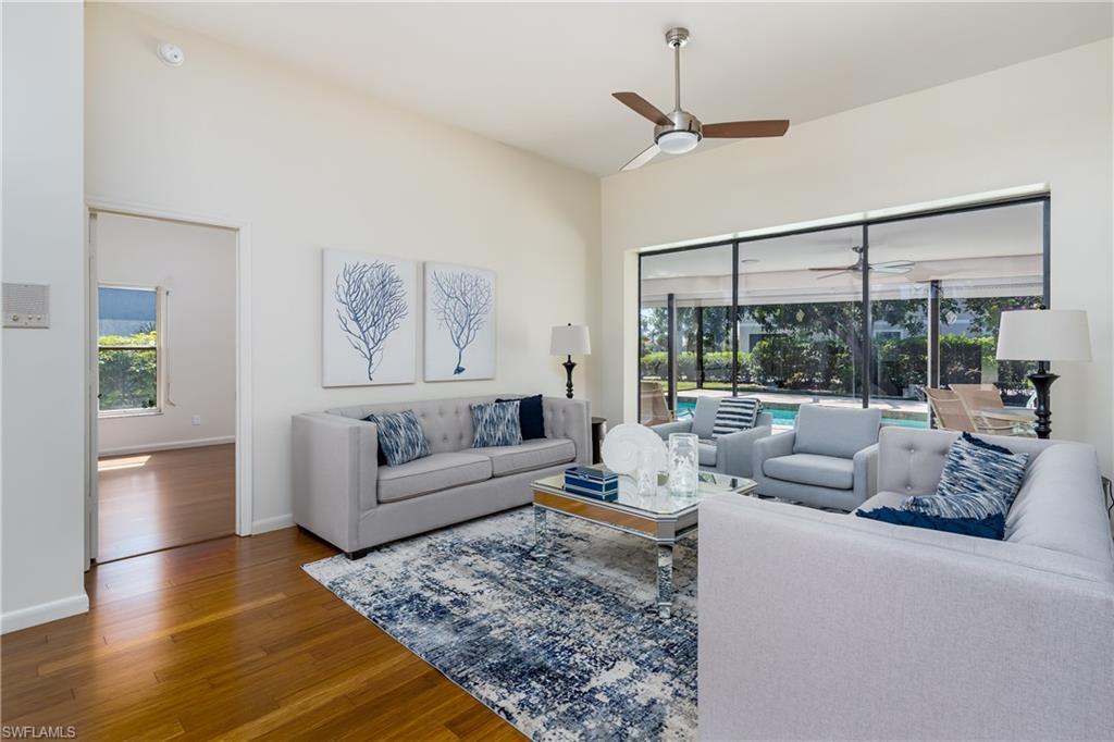 1172 Kings Way Naples, FL 34104 - Photo 9 of 50 a living room with furniture and a large window