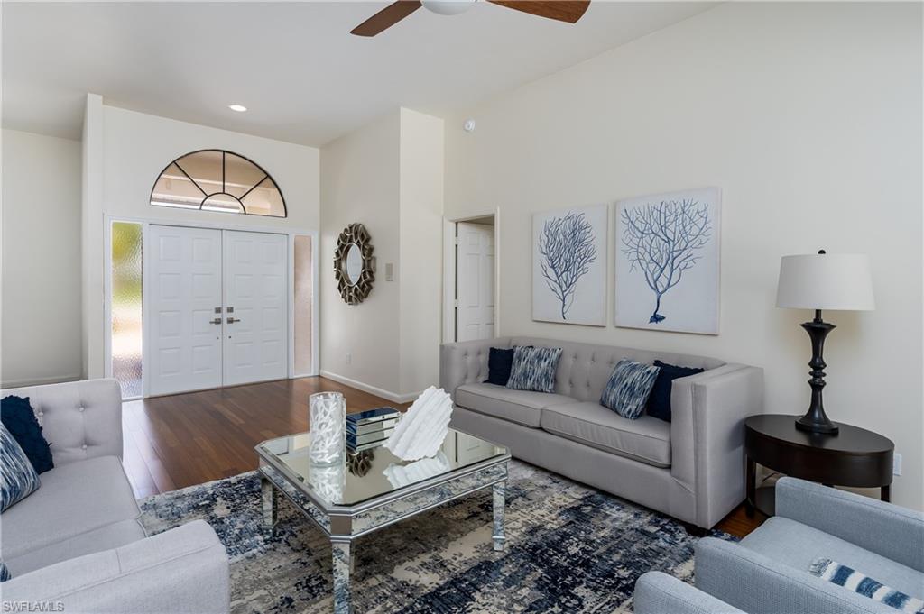 1172 Kings Way Naples, FL 34104 - Photo 10 of 50 a living room with furniture a rug and a window