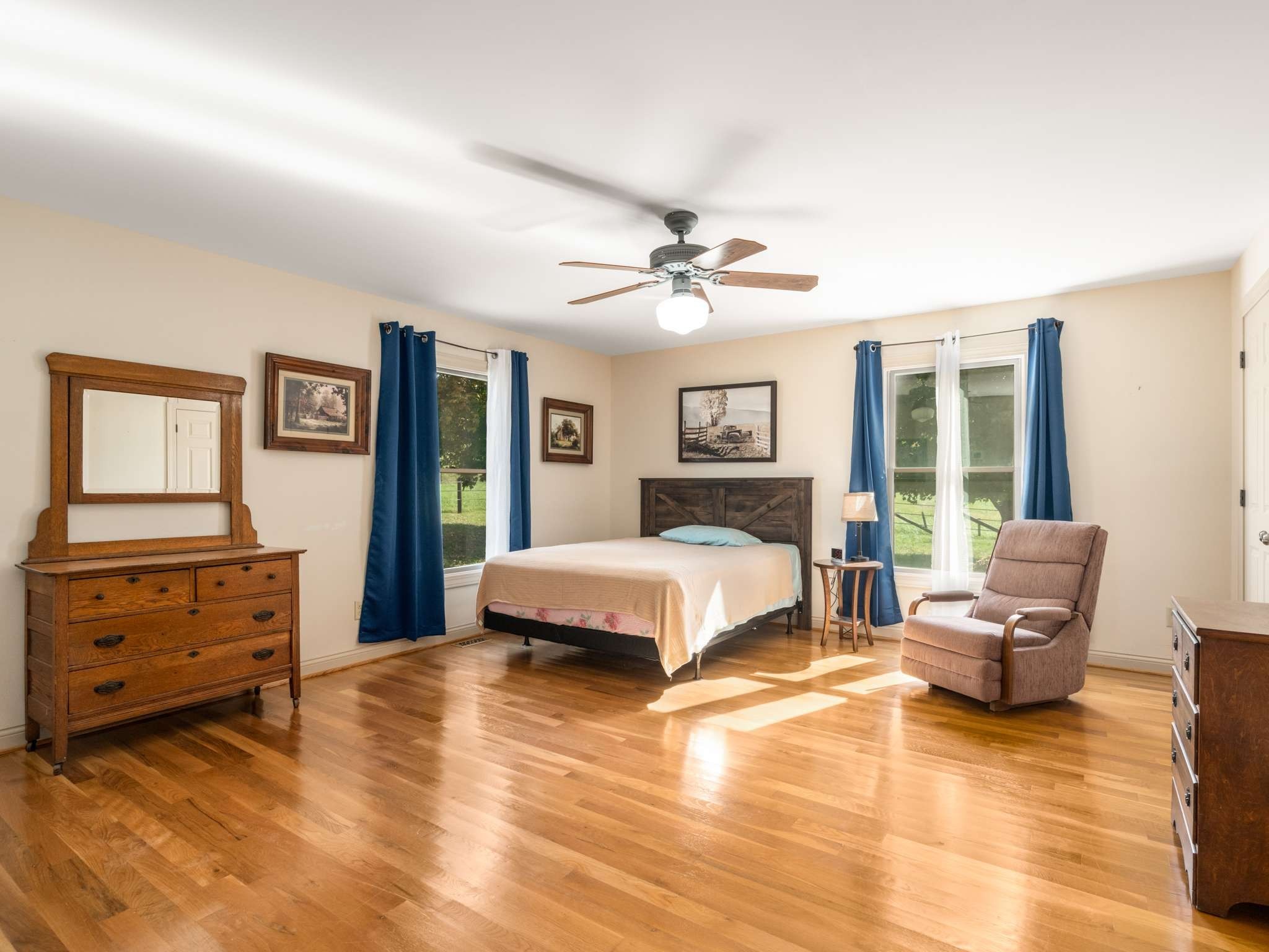2840 Thomas Road Nolensville, TN 37135 - Photo 23 of 49 a spacious bedroom with a bed and wooden floor