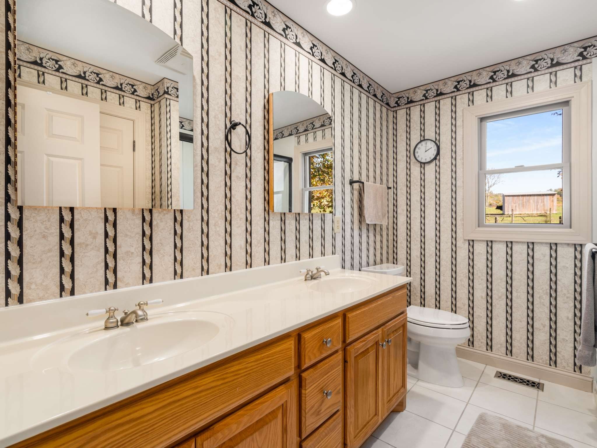 2840 Thomas Road Nolensville, TN 37135 - Photo 25 of 49 a bathroom with a sink a toilet and a large mirror