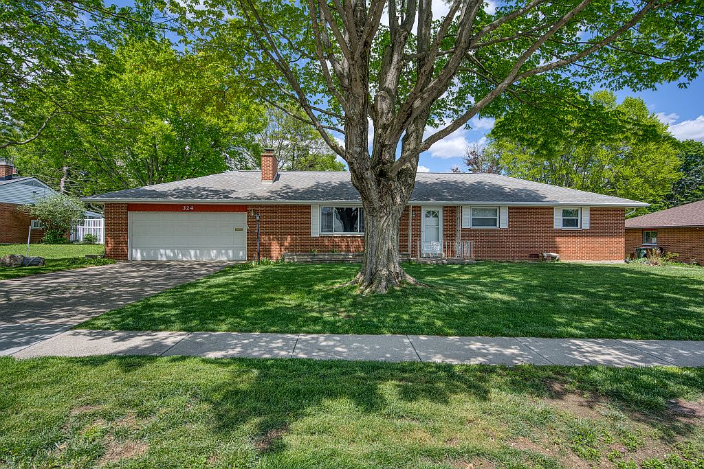 324 Beckenham Road Englewood, OH 45322 - Photo 1 of 26 This classic brick residence features an attached garage and well-maintained landscaping, creating inviting curb appeal.
