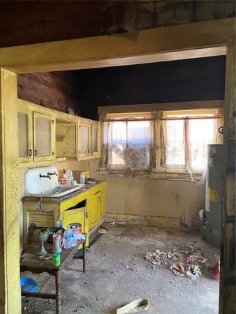 a view of a room that has a large window