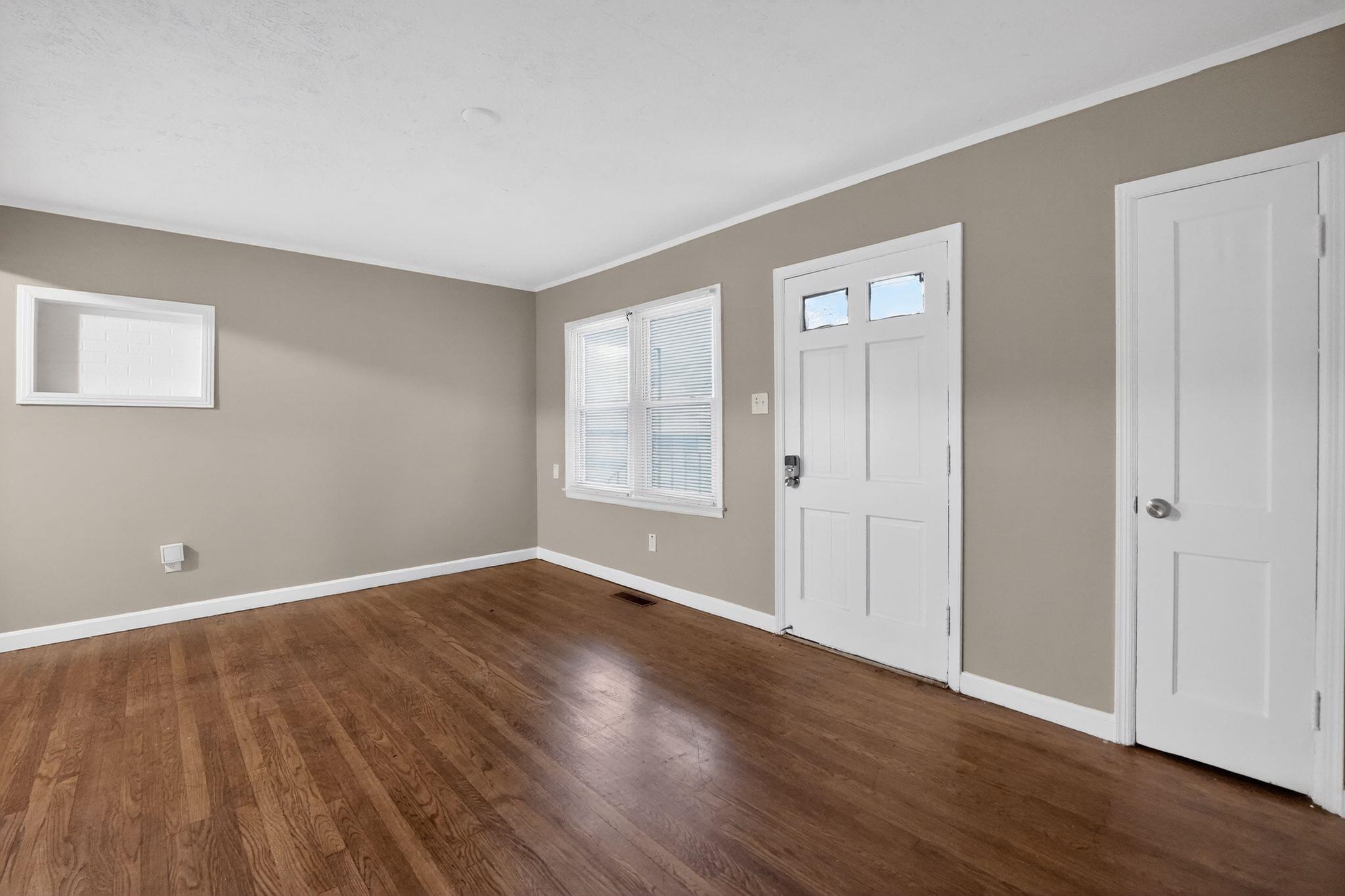 4067 Grantham Road Memphis, TN 38109 - Photo 12 of 34 Entryway featuring dark wood-type flooring and crown molding