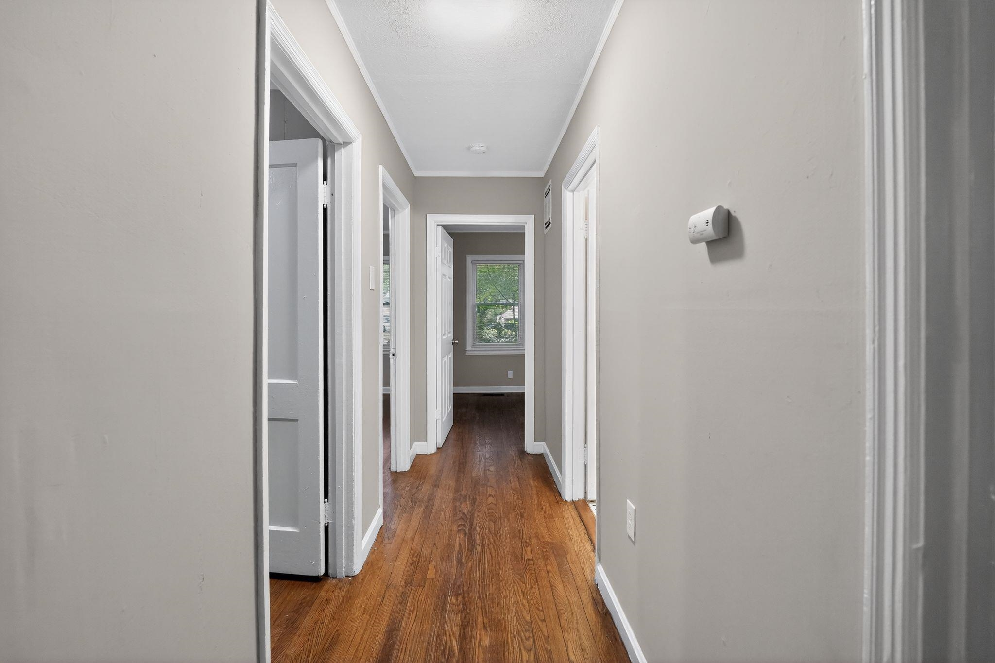 4067 Grantham Road Memphis, TN 38109 - Photo 32 of 34 Hall featuring ornamental molding and dark wood-style flooring