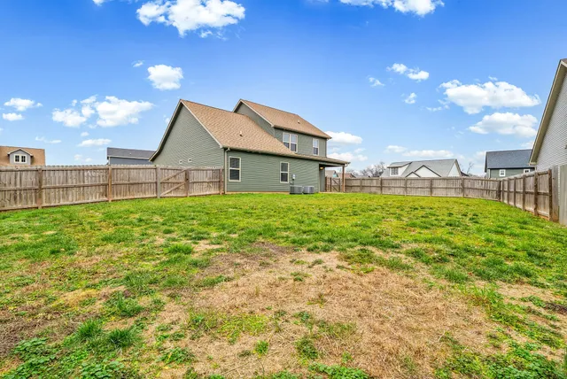 a house view with a garden space