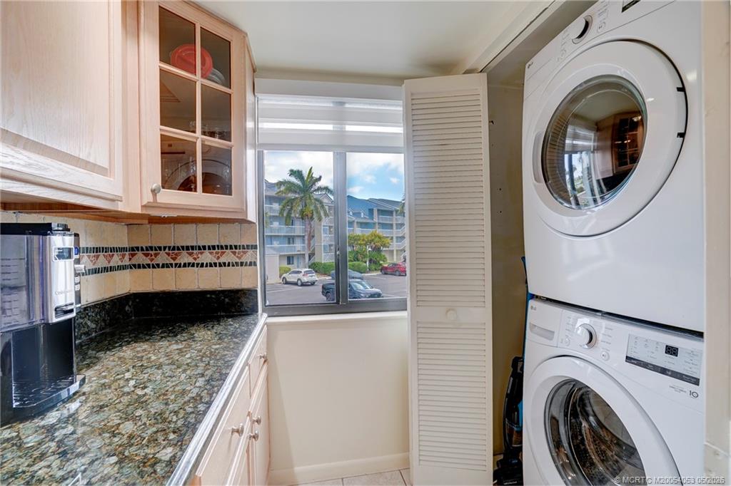 10 Northeast Plantation Road, Unit 101 Jensen Beach, FL 34957 - Photo 32 of 53 a view of a hallway with washer and dryer