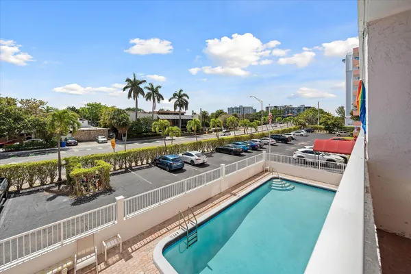 a view of a swimming pool with a patio
